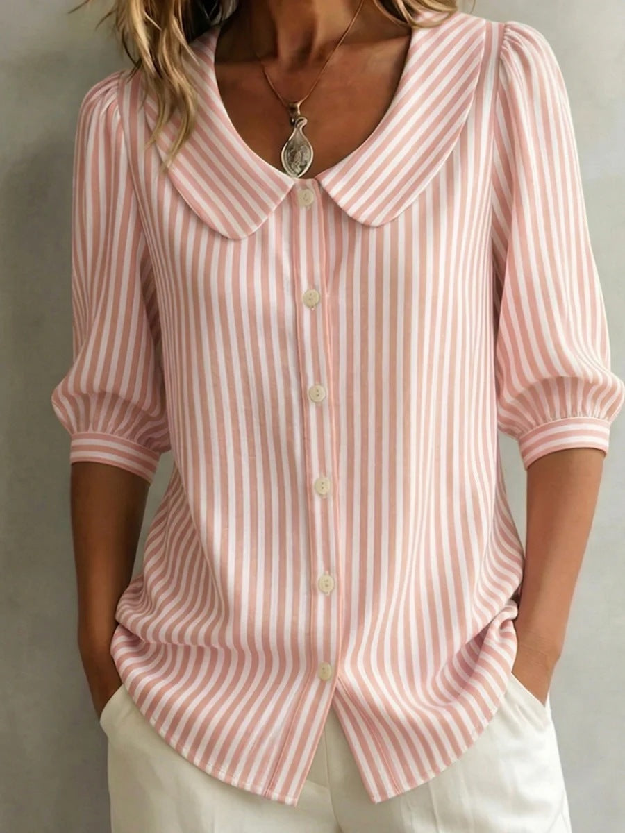 Striped V-neck top with three-quarter sleeves, casualwear by Plush Fashion Hub, shown on a model.
