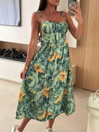 Women's striped tie-shoulder midi dress from Trendsi featuring casual summer style, perfect for brunch or warm weather outings.