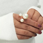 18K gold-plated open ring with lustrous pearls, showcasing elegant jewelry design and fine craftsmanship.