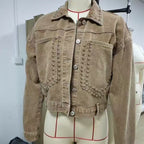Women’s studded denim jacket by Plush Fashion Hub featuring silver studs on classic blue denim fabric.
