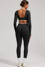Fitglutes Activewear long sleeve crop top and leggings 2-piece set, stylish gymwear for women, shown in black with sleek design.