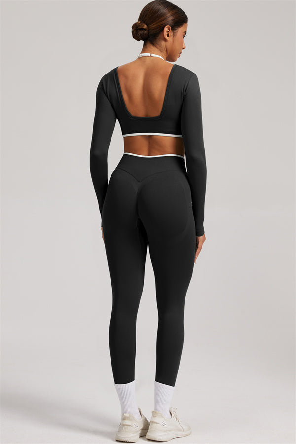 Fitglutes Activewear long sleeve crop top and leggings 2-piece set, stylish gymwear for women, shown in black with sleek design.