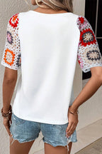 Geometric print round neck short sleeve blouse from Plush Fashion Hub, featuring a stylish design and comfortable fit.