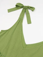 Women's cotton tiered frill V-neck sleeveless summer dress by Trendsi, featuring a flowy, lightweight design with ruffle details.