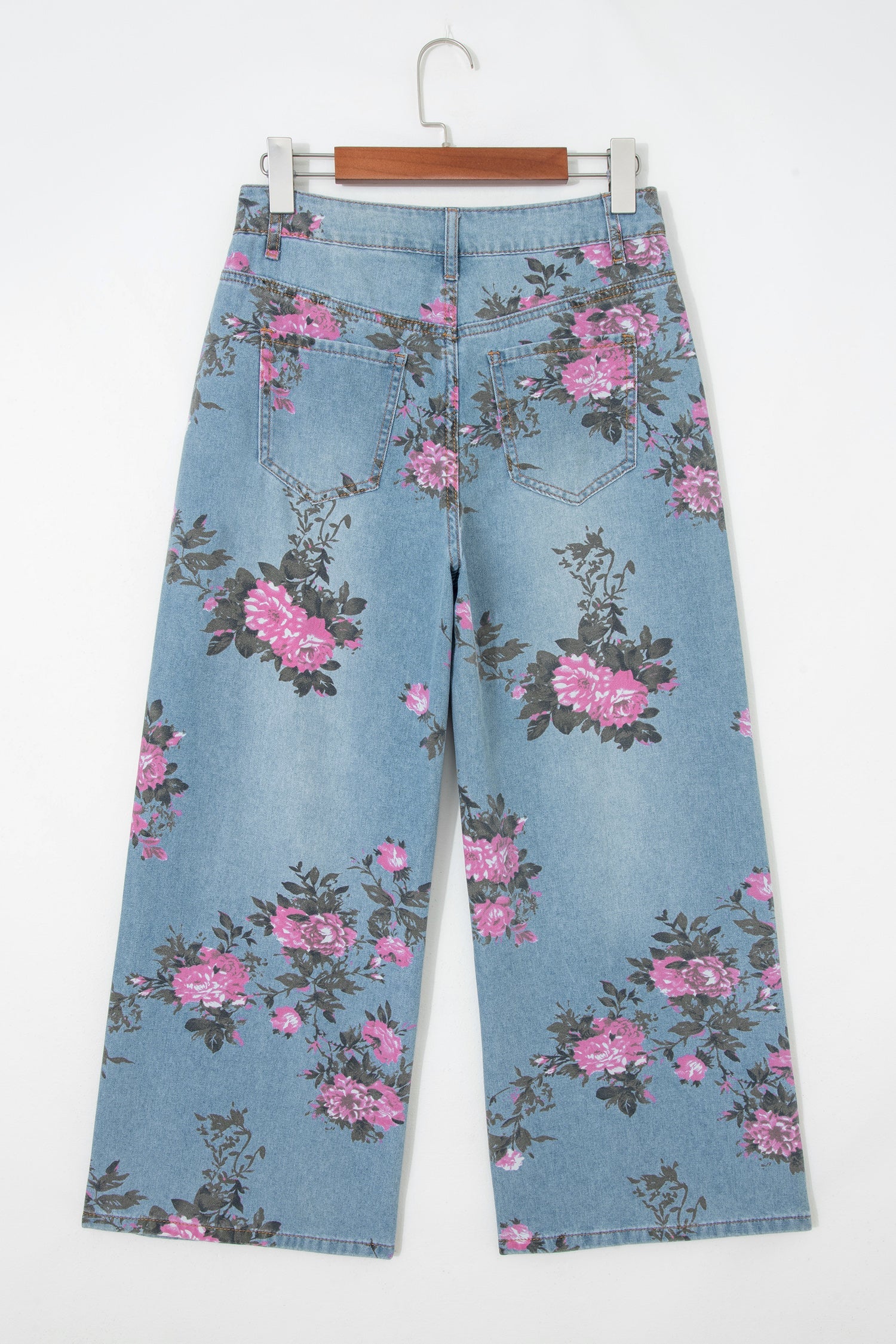Threaded Pear Esme floral print bootcut jeans showing a stylish denim pair with colorful floral patterns and classic bootcut fit.