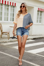 Striped round neck half-sleeve T-shirt from Trendsi featuring a casual fit and colorful horizontal stripes.
