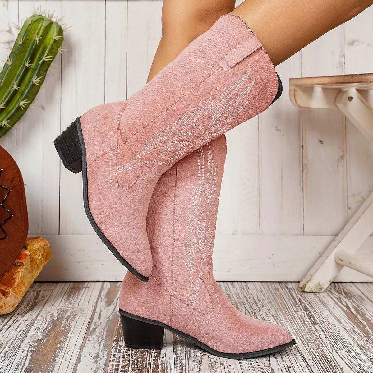 Point toe block heel boots by Trendsi featuring sleek black leather, stylish design, and sturdy block heels for a chic look.
