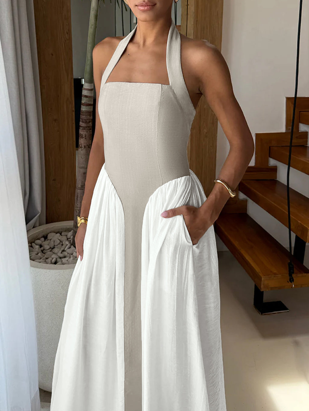 Elegant two-tone halter neck maxi dress by Plush Fashion Hub featuring ruched design and convenient pockets, perfect for stylish occasions.