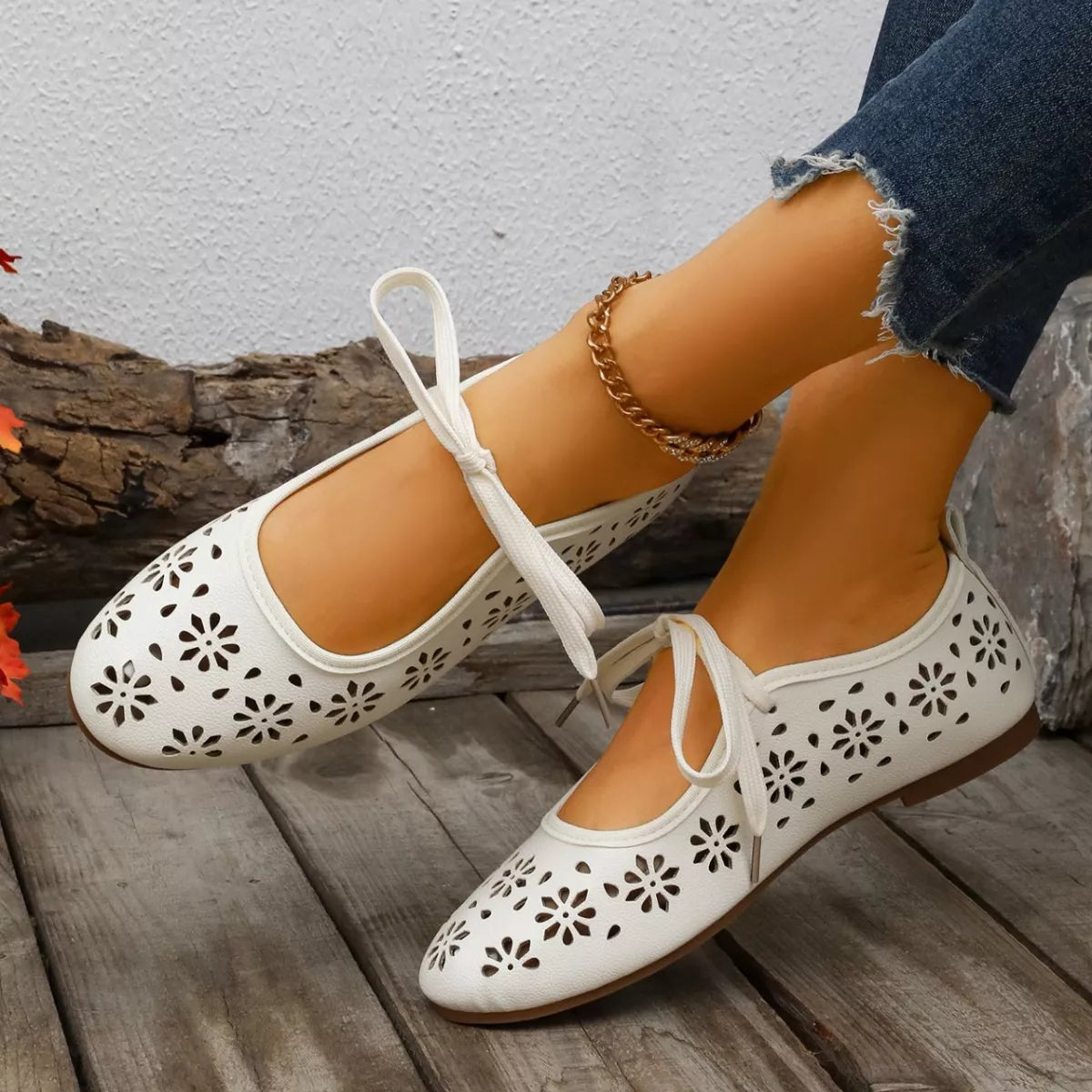 Floral cutout tied slip-on sandals by Plush Fashion Hub featuring open toes and decorative floral patterns.