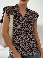 Leopard print ruffle sleeve blouse from Plush Fashion Hub, showcasing stylish design with ruffled sleeves and bold animal print.