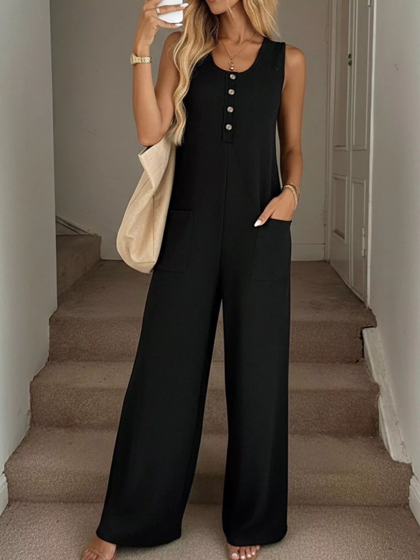 Plush Fashion Hub sleeveless button-front wide-leg jumpsuit with pockets, casual chic romper in lightweight fabric.