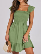 Women's lightweight smocked ruffle hem mini dress by Trendsi, casual summer dress with a breezy, flowy design and ruffled details.