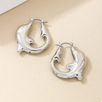 18K gold-plated dolphin hoop earrings with detailed fin and tail design, lightweight jewelry for daily wear