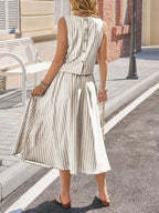 Women's striped sleeveless top and midi skirt two-piece set by Trendsi, featuring a stylish coordinated outfit with bold stripes.