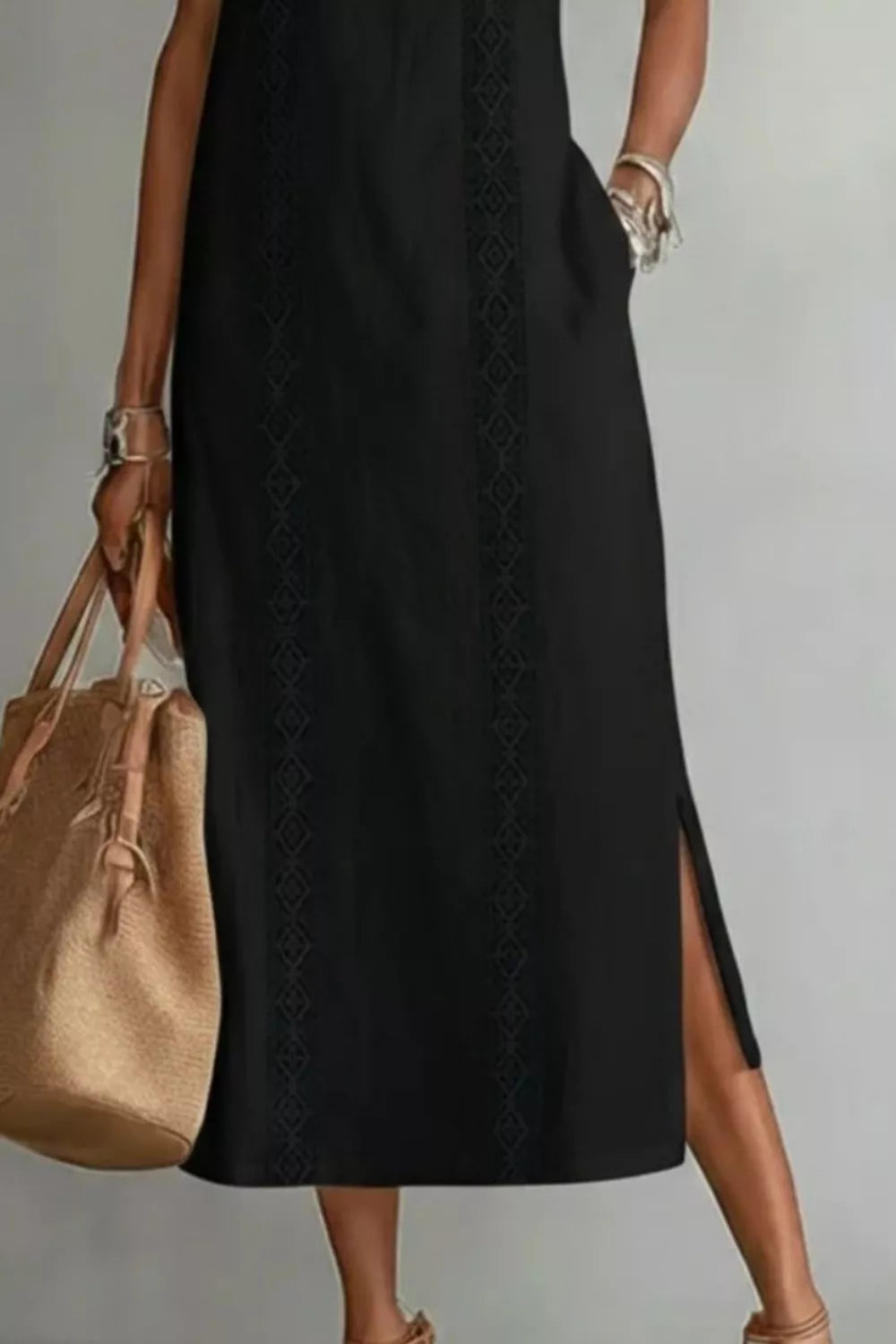 Women's sleeveless maxi dress with side slit and pockets by Plush Fashion Hub, flowing fabric and stylish design.