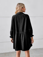 VYSN button-up mini denim dress with flounce sleeves, showing the fitted bodice and stylish design on a model.