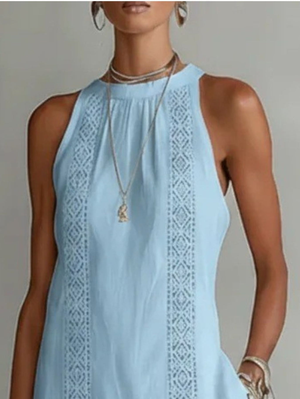 Sleeveless hollow-out midi dress with side slit and pockets by Plush Fashion Hub, showing its stylish cut and fabric details.
