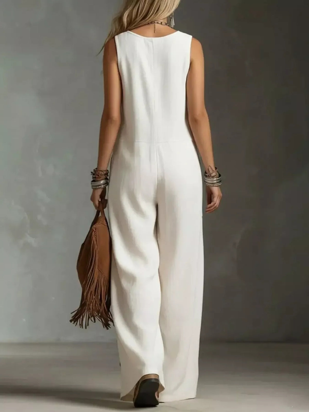 Plus size sleeveless button-front wide-leg jumpsuit by Plush Fashion Hub, featuring a full-length design and stylish silhouette.