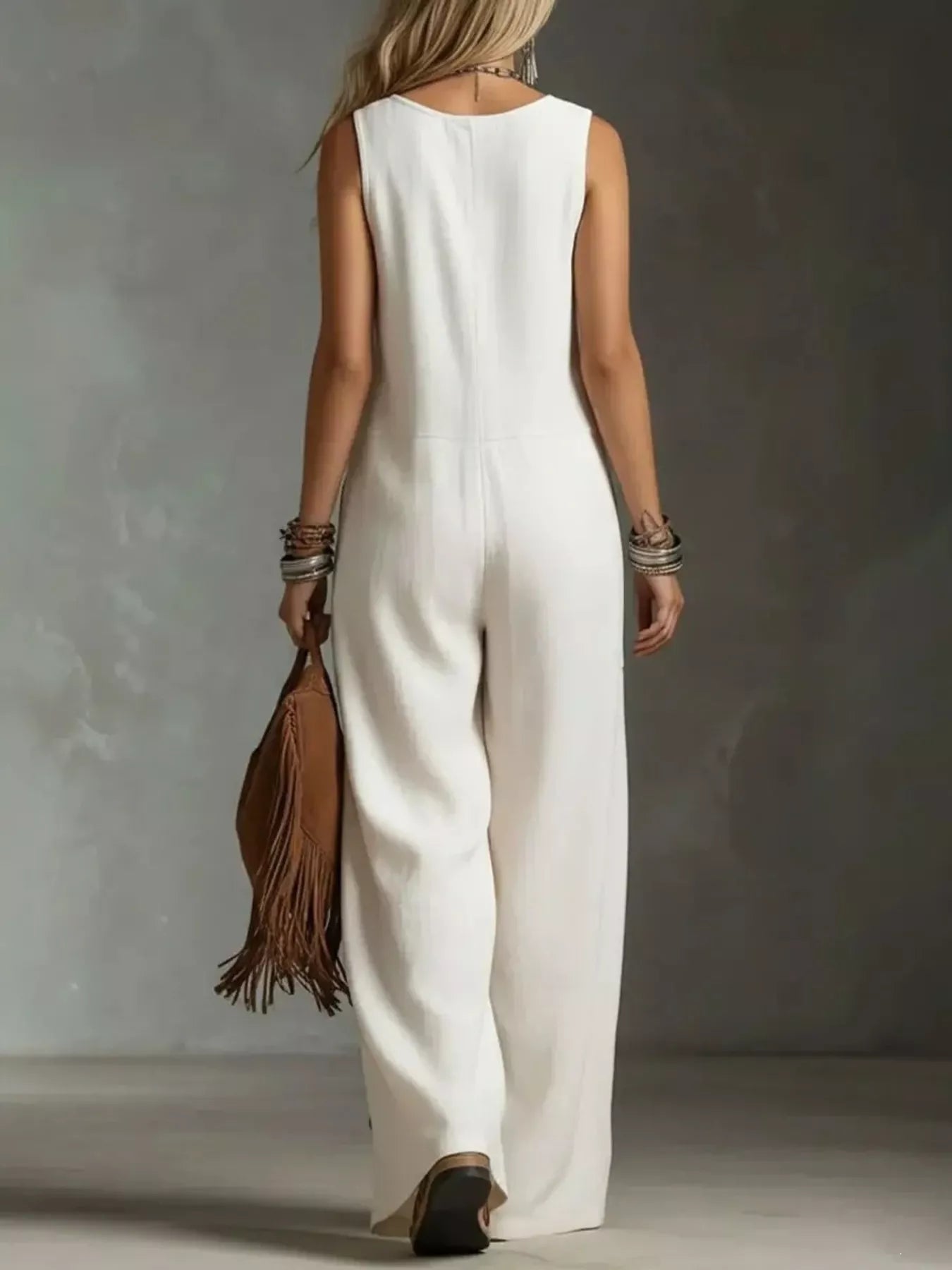 Plush Fashion Hub sleeveless plus size jumpsuit with button front and wide leg design, perfect for casual or stylish wear.