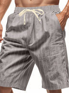 Men's plus size striped casual shorts with drawstring waist by Trendsi, featuring a relaxed fit and comfortable fabric.