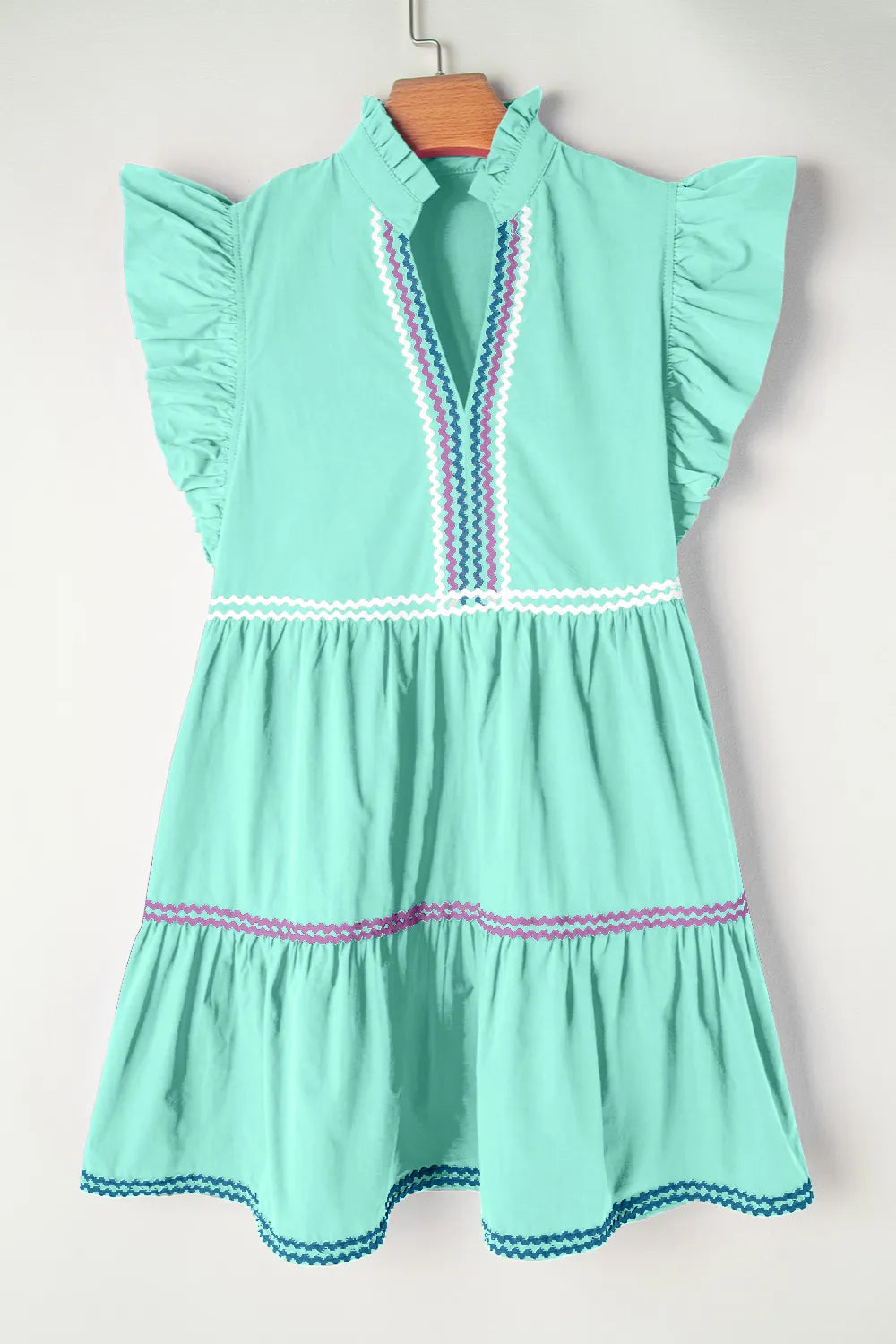 Cotton ruffled notched cap sleeve mini dress by Trendsi featuring a fitted bodice and flared hem, perfect for casual summer wear.