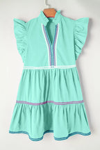 Cotton ruffled notched cap sleeve mini dress by Trendsi featuring a fitted bodice and flared hem, perfect for casual summer wear.