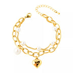 18K gold-plated heart charm bracelet with delicate chain and adjustable clasp, stylish jewelry accessory.