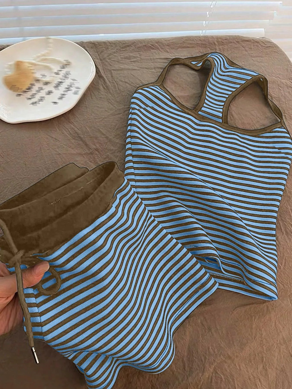 Striped tank top and shorts set by Trendsi, featuring a casual sleeveless top and matching shorts with colorful stripes.