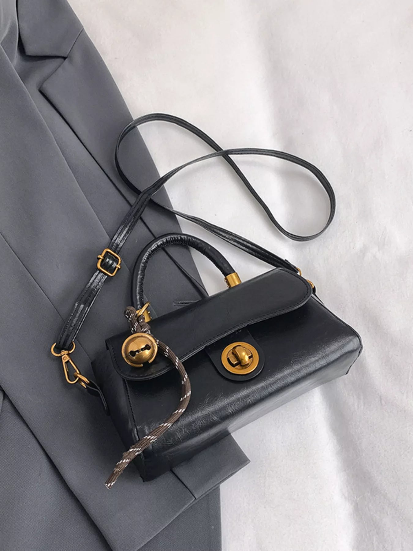 Simply Love top handle crossbody bag with a sleek design, featuring a strap and elegant style for everyday use.