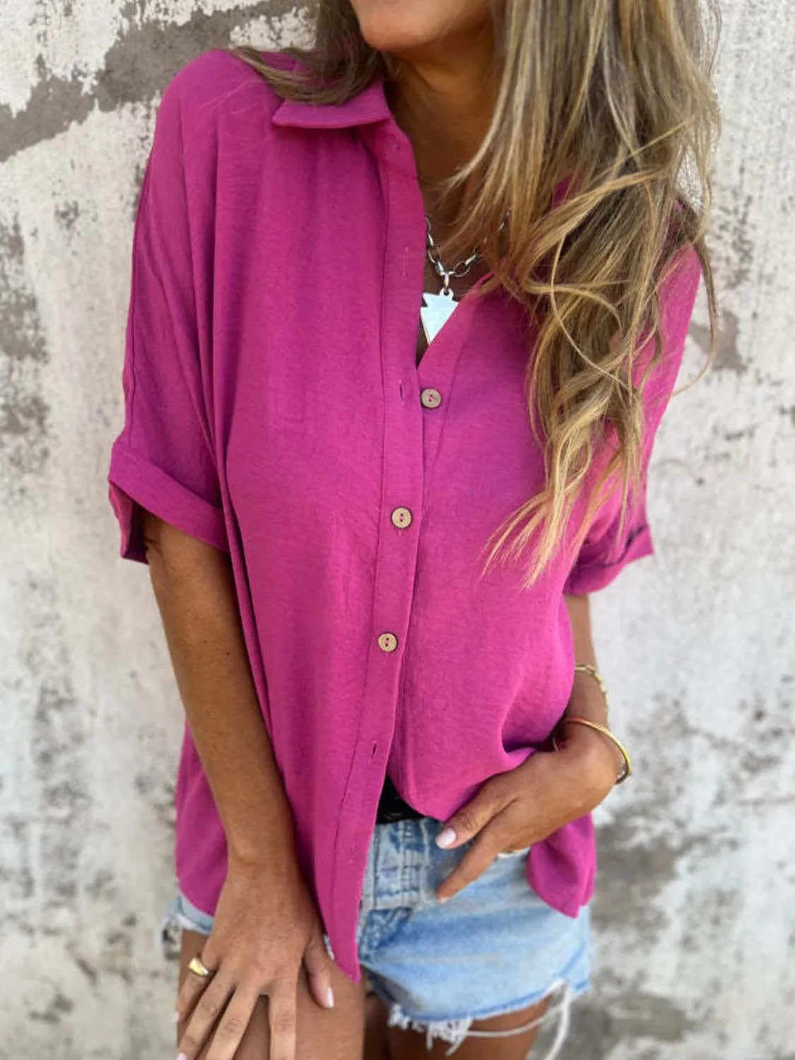 Women's collared half sleeve button-down blouse in a sophisticated office top style, featuring a classic design and tailored fit.
