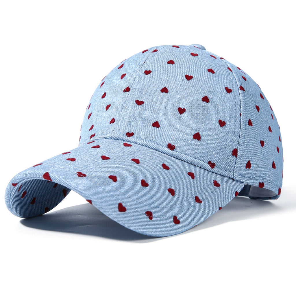 Women's heart print casual baseball hat with adjustable strap, trendy sport cap by Trendsi, perfect for casual wear and outdoor activities.