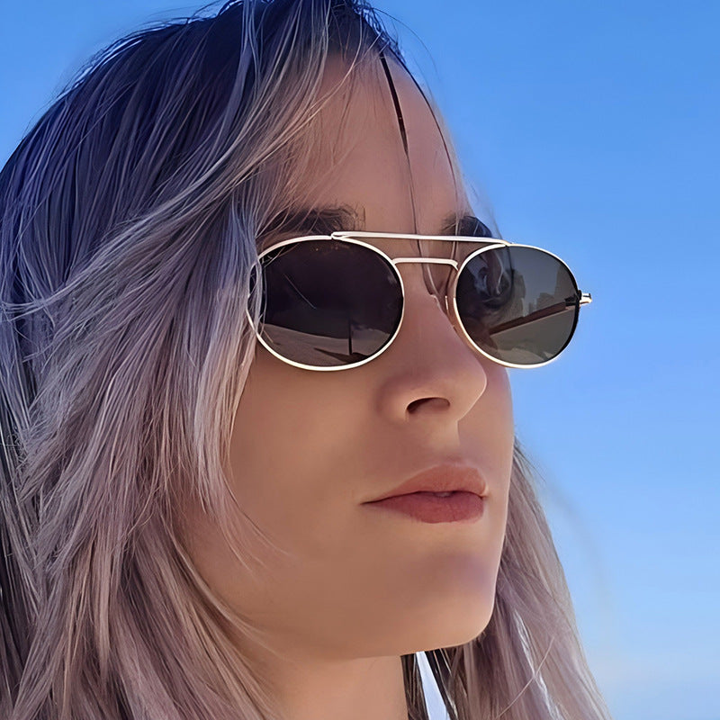 Retro oval metal sunglasses with dual-beam design and UV protection, stylish eyewear by Plush Fashion Hub.
