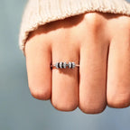 Sterling silver ring with inlaid zircon stones, crafted in 925 silver, showcasing elegant design and sparkling gemstone details.