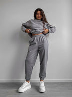 Plush Fashion Hub women's two-piece set with loose-fit crewneck sweatshirt and jogger pants in soft, casual style.