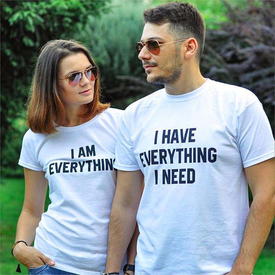 Couples wearing matching FitiqueFit short sleeve casual T-shirts, front view, showcasing comfortable, stylish everyday wear.