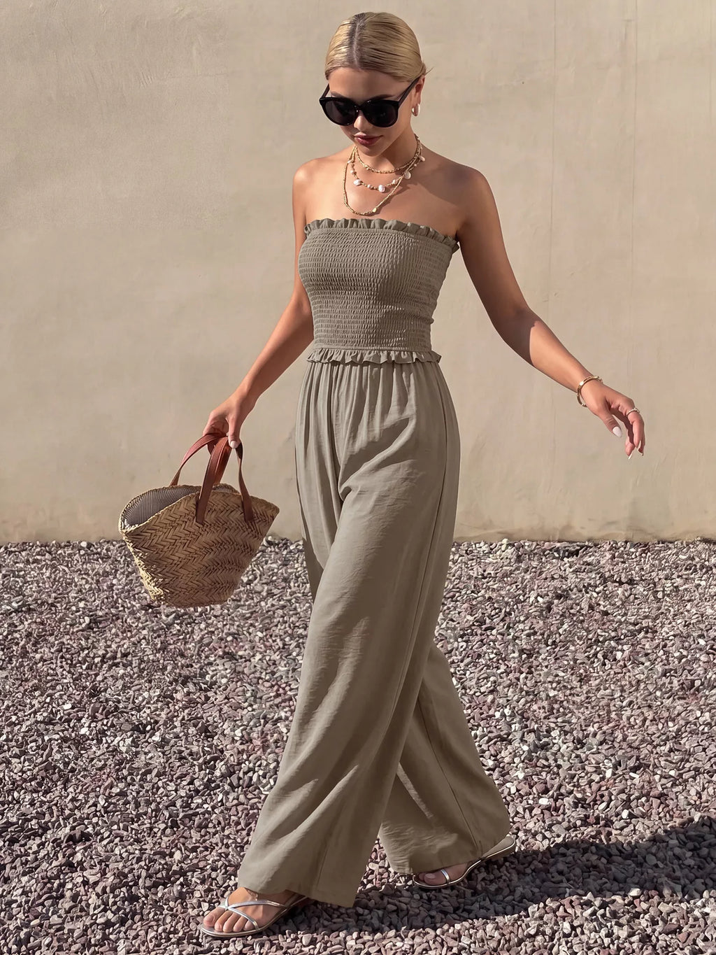 Smocked strapless wide-leg jumpsuit by Plush Fashion Hub, featuring a fitted bodice and flowing pant legs in a stylish design