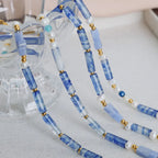 Freshwater pearl and titanium steel geometric bead necklace featuring modern design, with alternating pearl and steel beads.