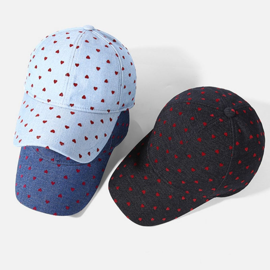 Women's heart print casual baseball hat from Trendsi, adjustable sport cap with cute heart design, perfect for casual wear.