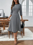 Classic plaid round neck midi dress with 3/4 sleeves from Trendsi, featuring a stylish, comfortable design and midi length.