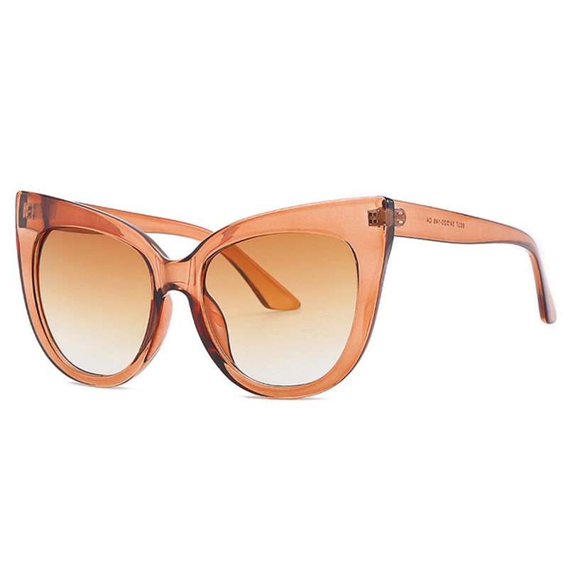 Women's oversized cat eye sunglasses with UV400 protection by Plush Fashion Hub, stylish eyewear with black frames and tinted lenses.