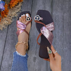 Plush Fashion Hub braided thong sandals with heart decor, featuring a flat sole and stylish design perfect for summer wear.