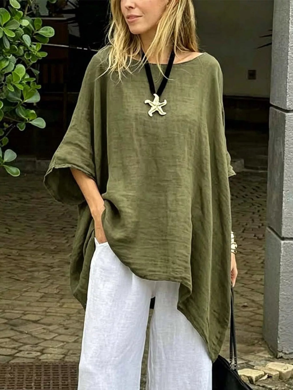 Plus size loose fit asymmetrical hem tunic top by Trendsi, showcasing relaxed fit and stylish design with a flowing hem.