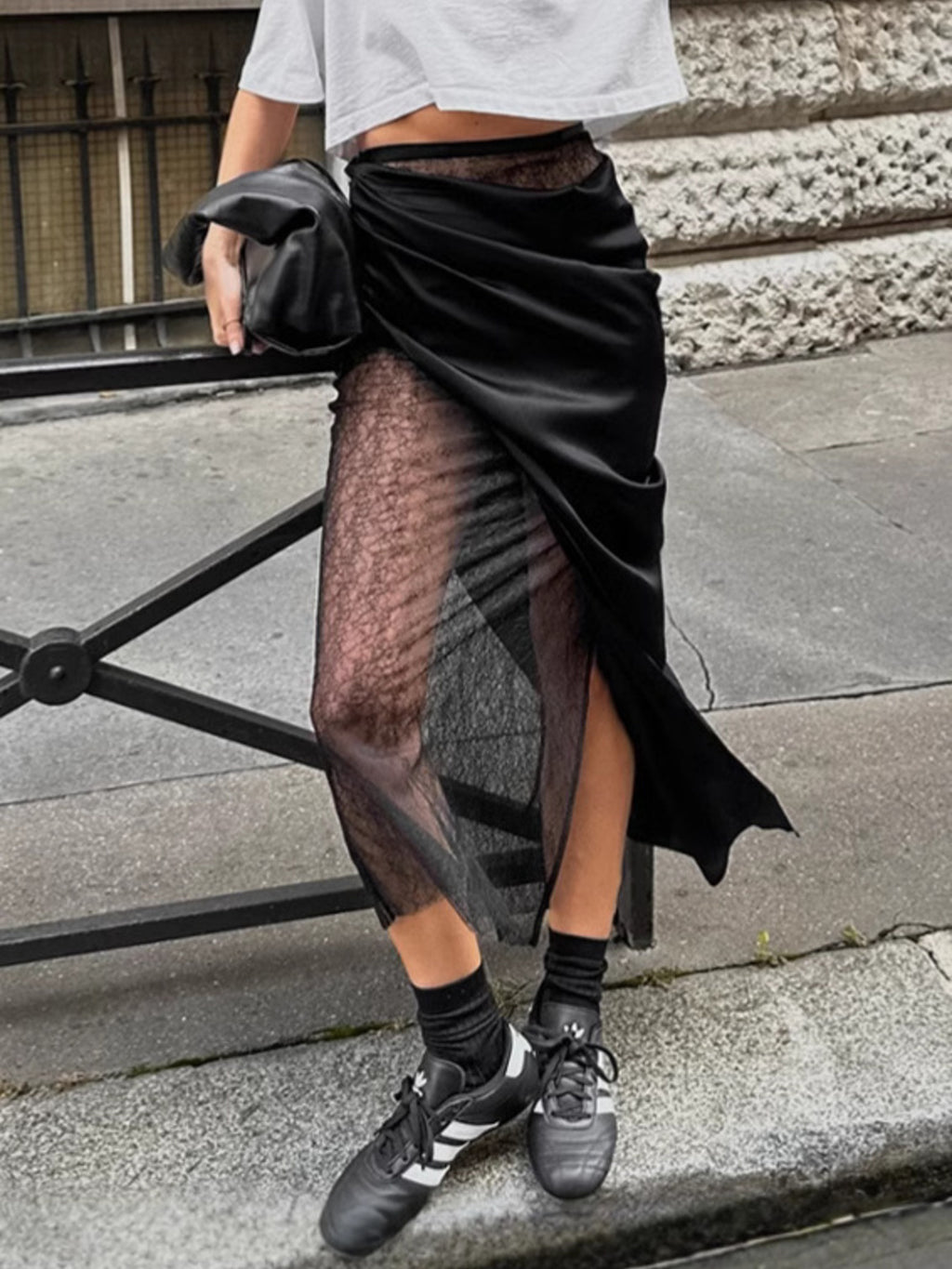 Elegant women's lace midi skirt with sheer split detail, stylish women's apparel by Trendsi, shown in the image.