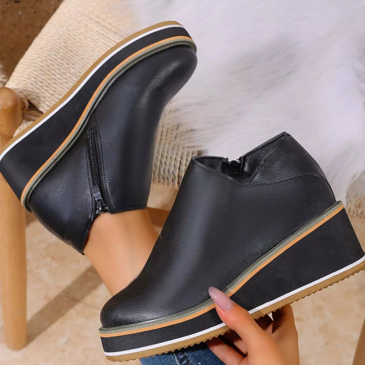 Women's round toe wedge ankle boots by Trendsi featuring stylish design and comfortable fit, shown from a front angle.