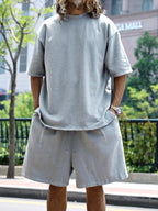 Men's relaxed fit T-shirt and shorts set by Trendsi, plus size casual tops and shorts for comfortable everyday wear.