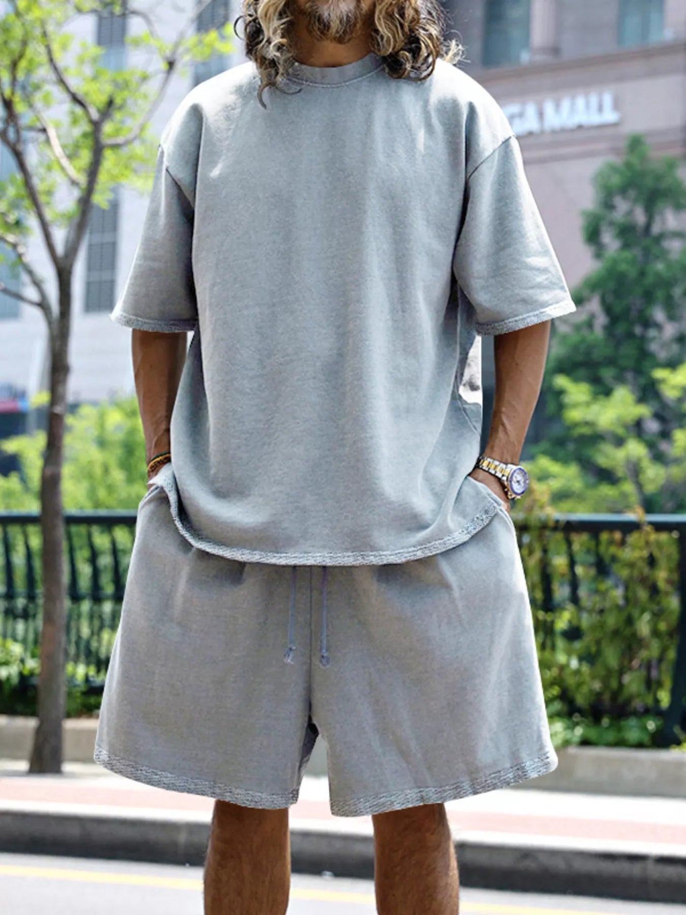 Men's relaxed fit T-shirt and shorts set by Trendsi, plus size casual tops and shorts for comfortable everyday wear.