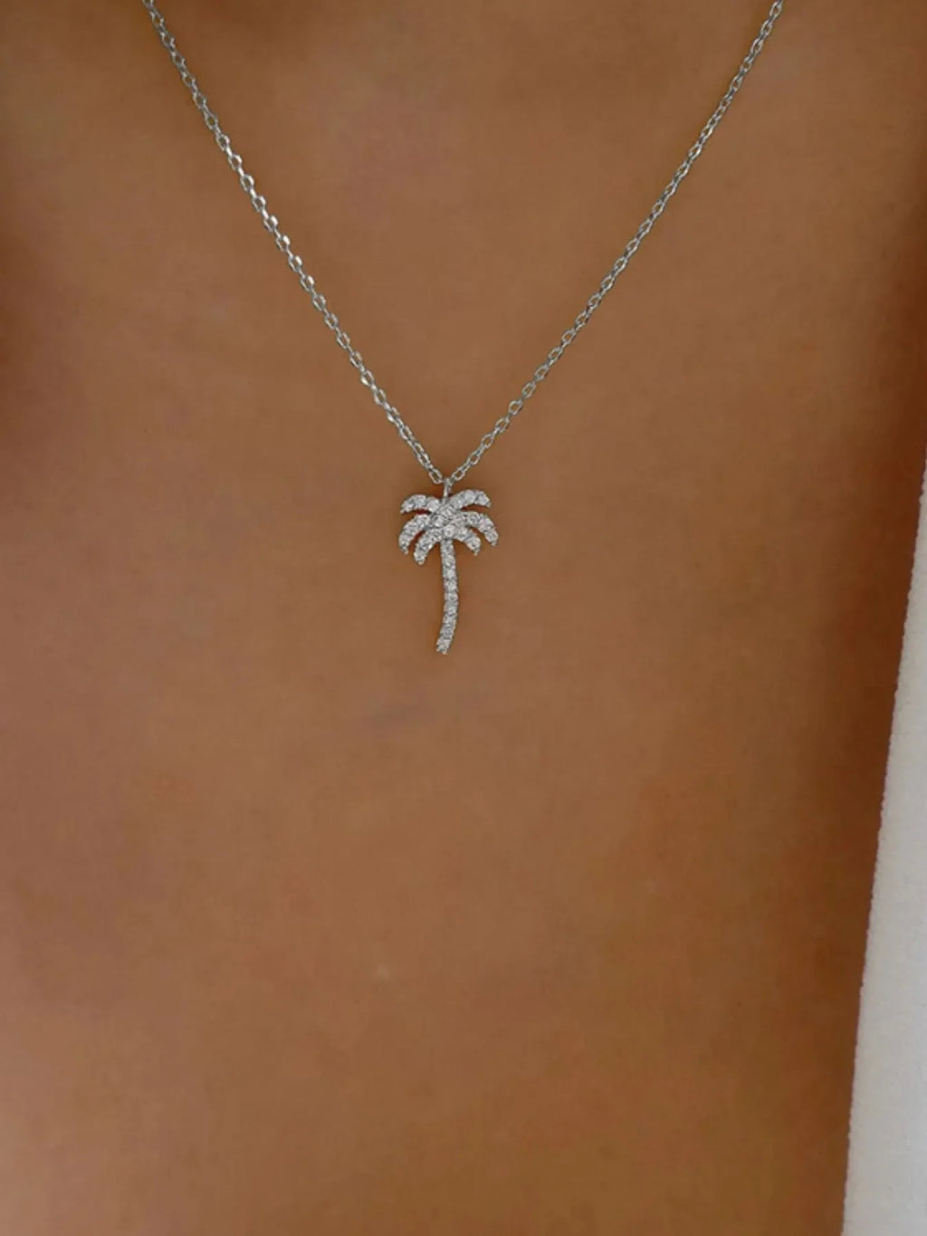 Zircon palm tree pendant necklace with sparkling stones on a delicate chain, stylish jewelry by Shopimist.