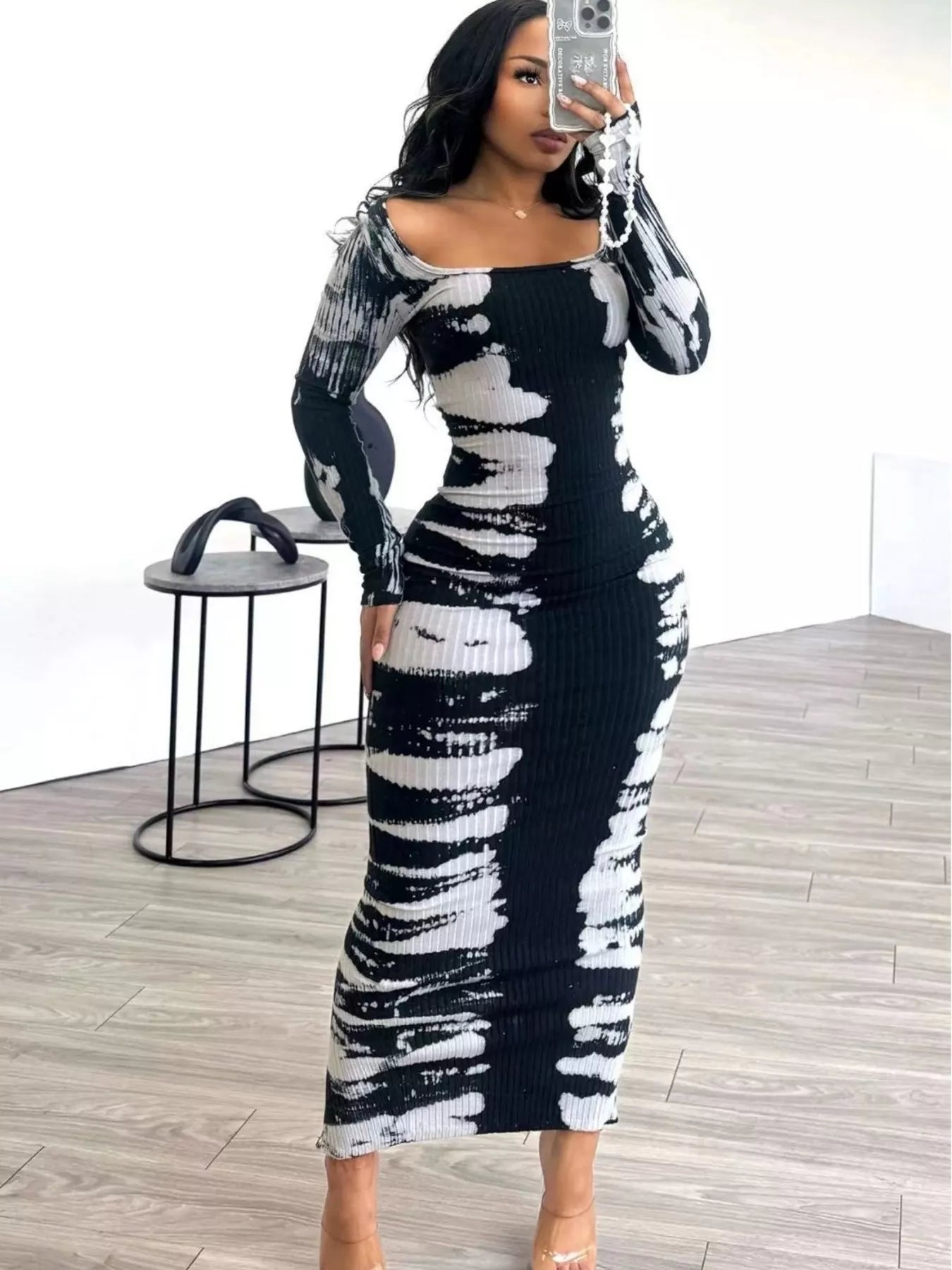 Colorful tie-dye long sleeve maxi dress by Plush Fashion Hub featuring a flowing design and vibrant pattern.