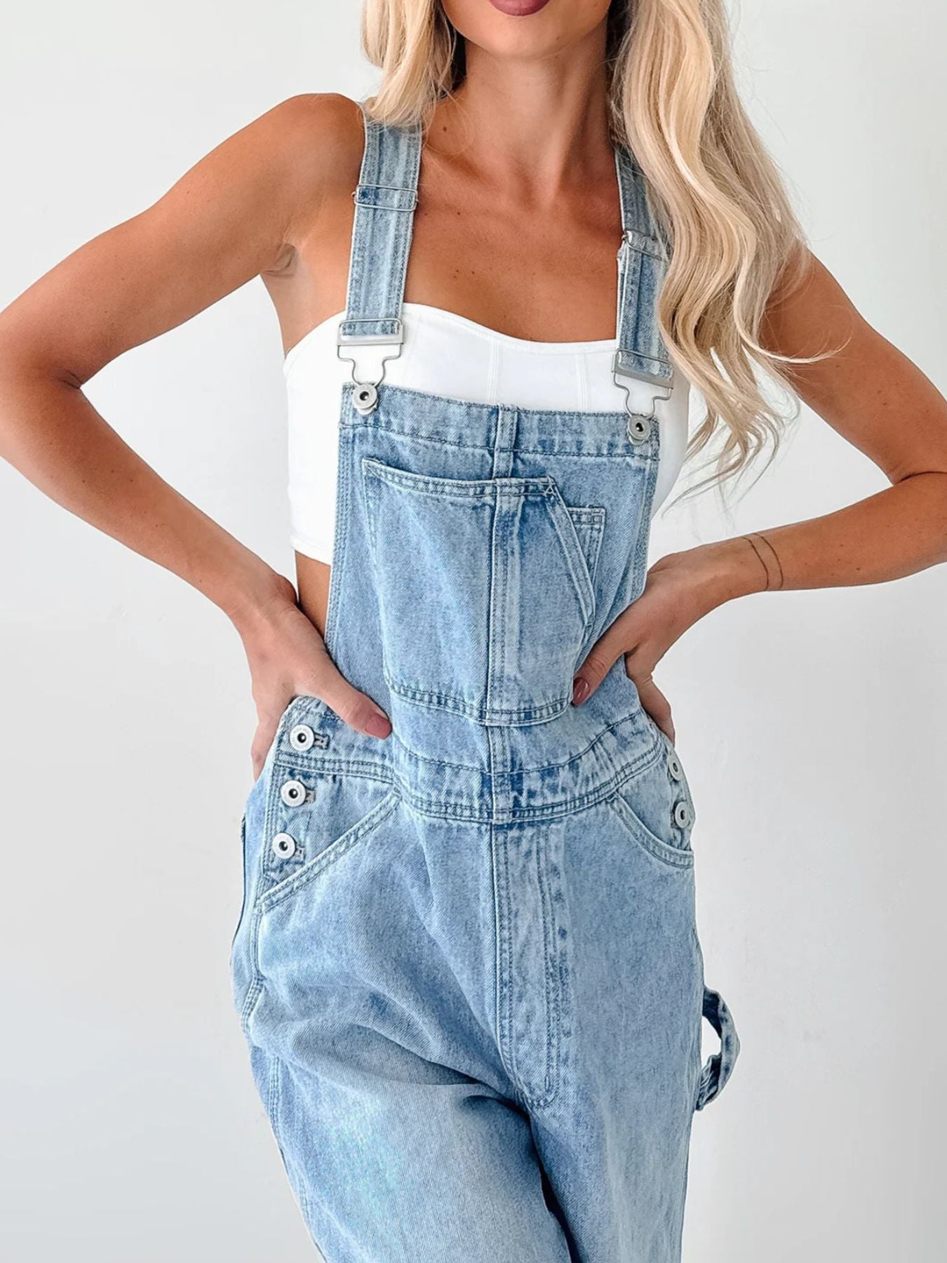 Women's relaxed fit wide strap denim overalls, casual trendy jumpsuit with comfortable fit and stylish design by Trendsi.