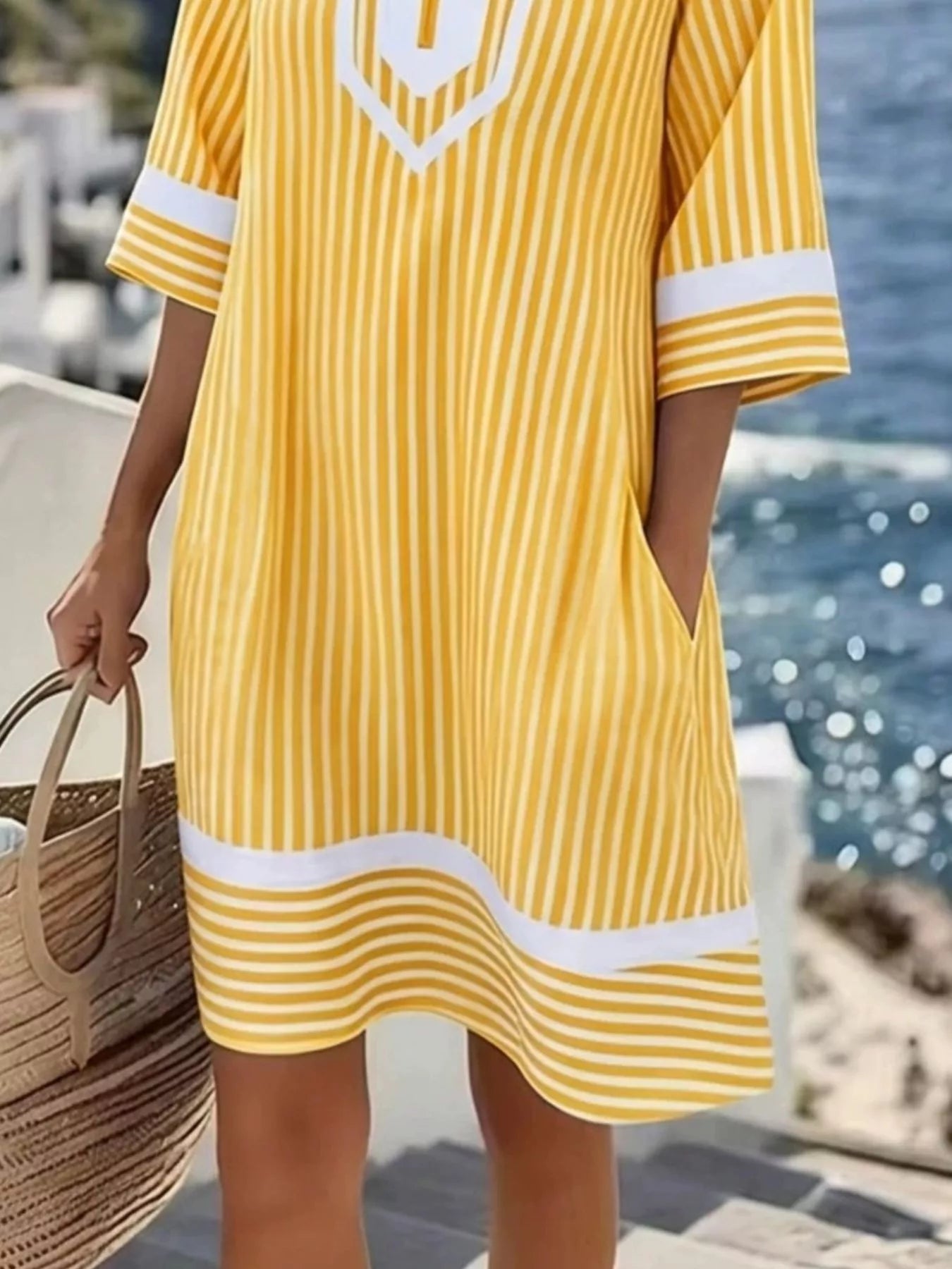 Plus size striped V-neck casual dress by Shopimist, featuring a full-length design with a relaxed fit and bold stripe pattern.
